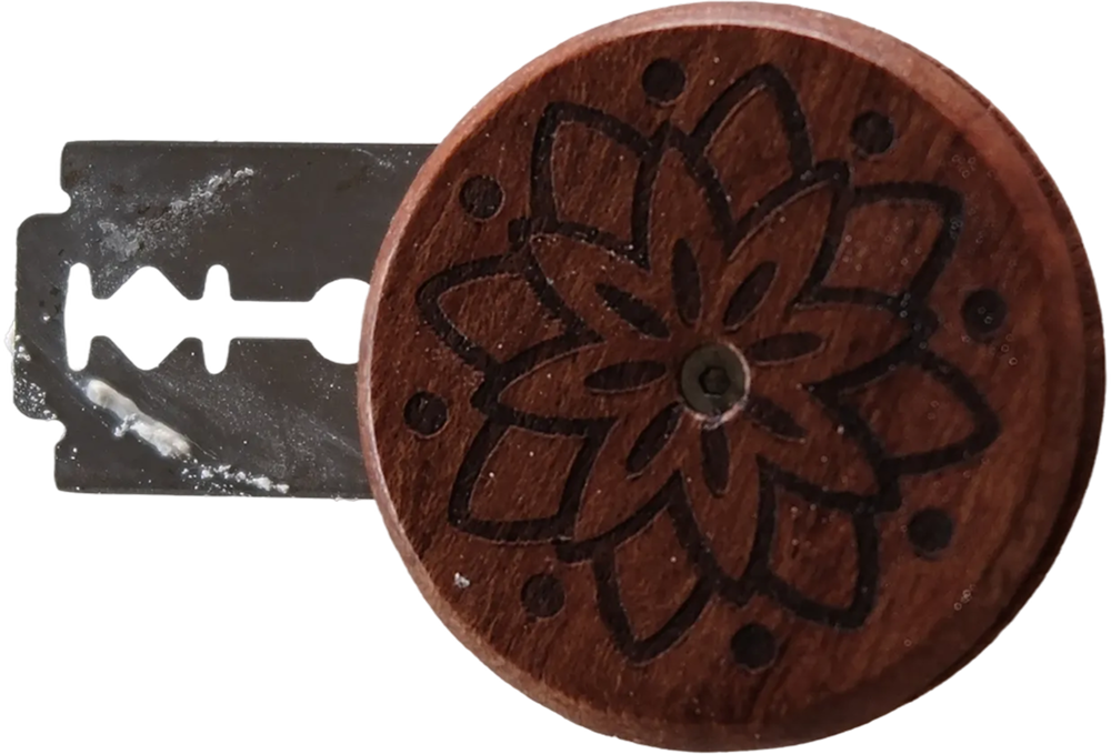 razor blade on a wooden handle