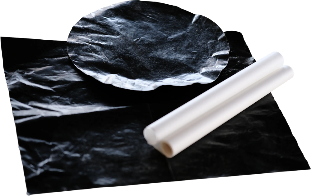 parchment and a teflon baking mat